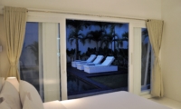 Bedroom with Pool View at Night - Villa Arta - Seminyak, Bali