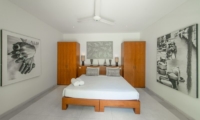 Bedroom with Wardrobes and Paintings - Villa Chocolat - Seminyak, Bali
