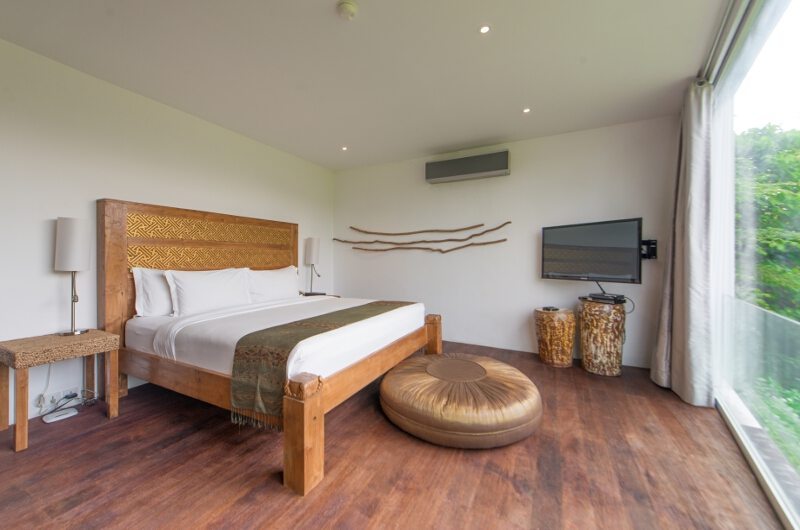 Bedroom with Wooden Floor and TV - Villa Ashoka - Canggu, Bali