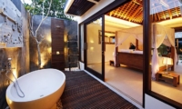 Bedroom and Semi Open Bathroom at Night - Chandra Villas - Seminyak, Bali