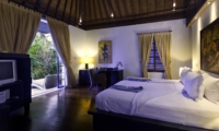 Bedroom with Wooden Floor and TV - Majapahit Beach Villas - Sanur, Bali