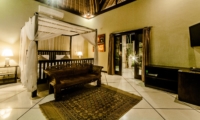 Bedroom with Sofa and TV at Night - Villa Kebun - Seminyak, Bali