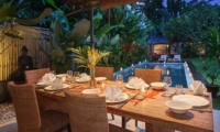 Dining Table with Pool View at Night - Villa Liang - Batubelig, Bali