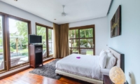 Bedroom with Wooden Floor and TV - Mary's Beach Villa - Canggu, Bali